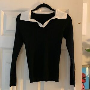 Medium black sweater with white collar